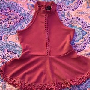 Tank top with design down middle.